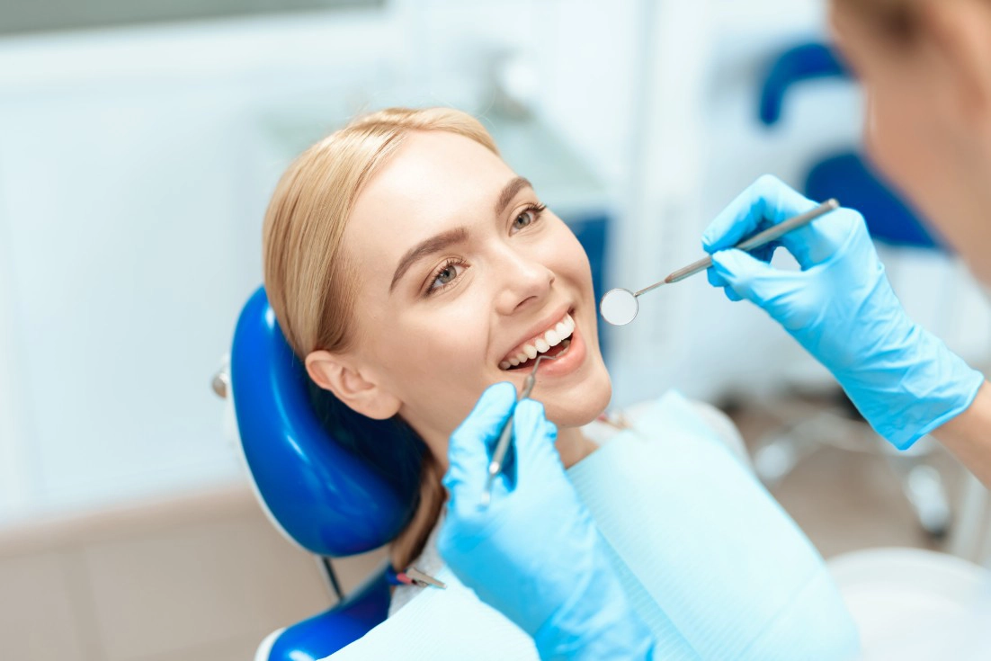 Patient smiling after cosmetic dental care